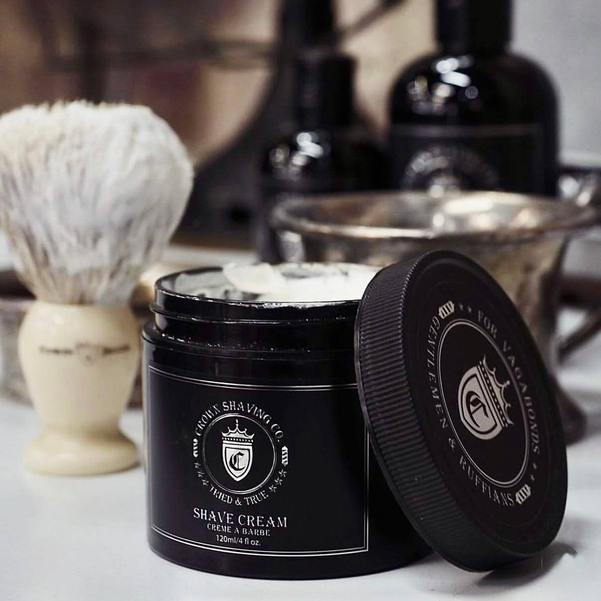 Crown Shaving Co. brush and black grooming jars on a counter