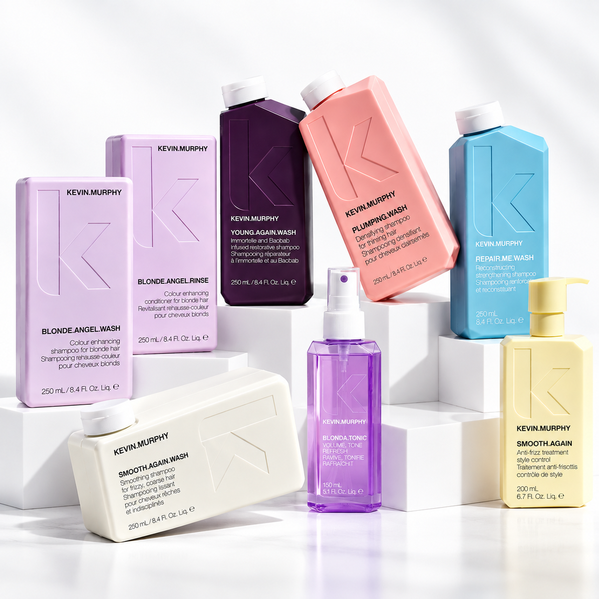 Pastel KEVIN.MURPHY haircare bottles and boxes on white