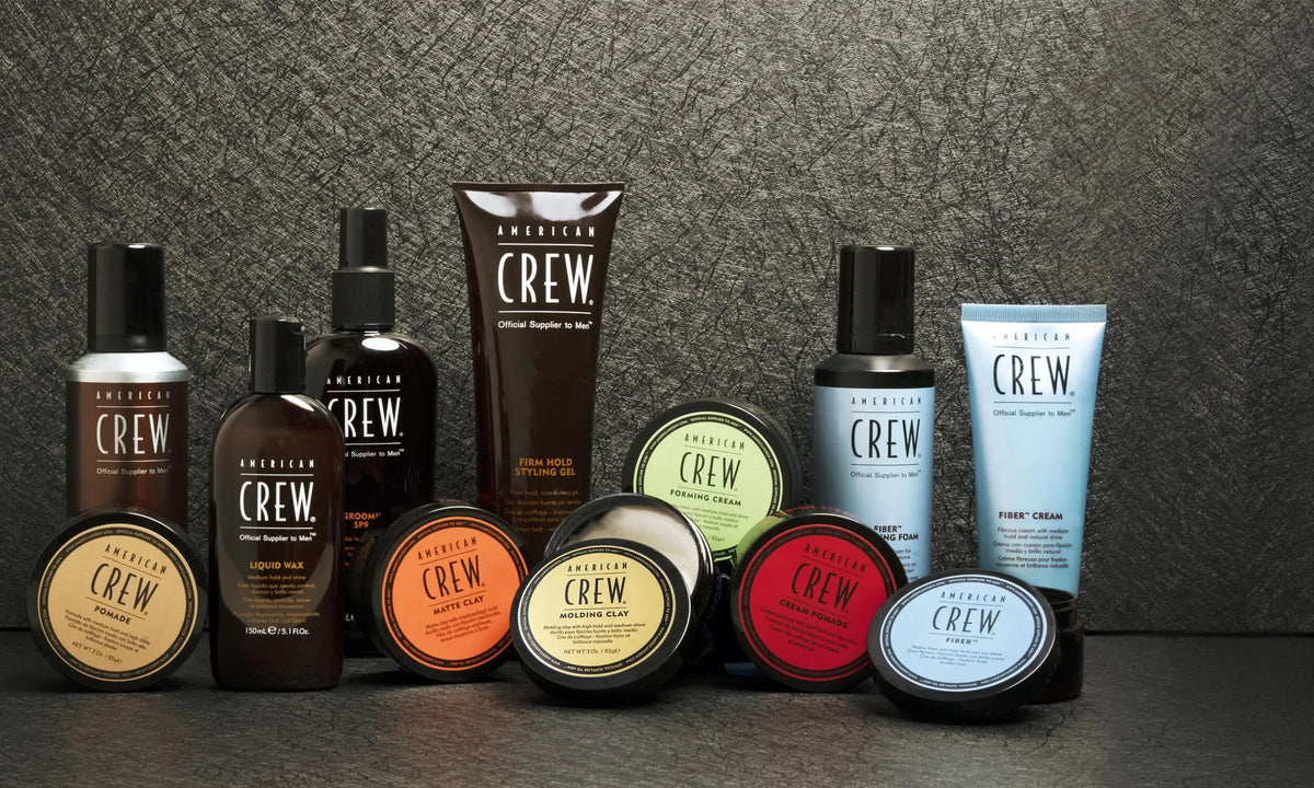 American Crew styling and grooming products on a dark surface