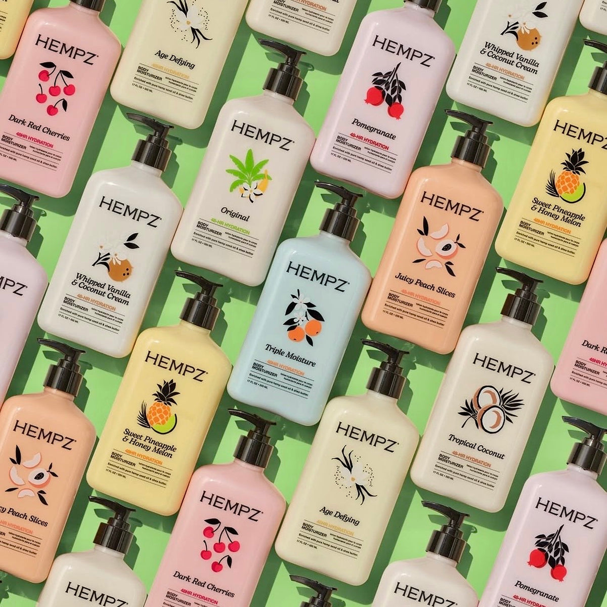 Assorted Hempz body lotion bottles in pastel colours