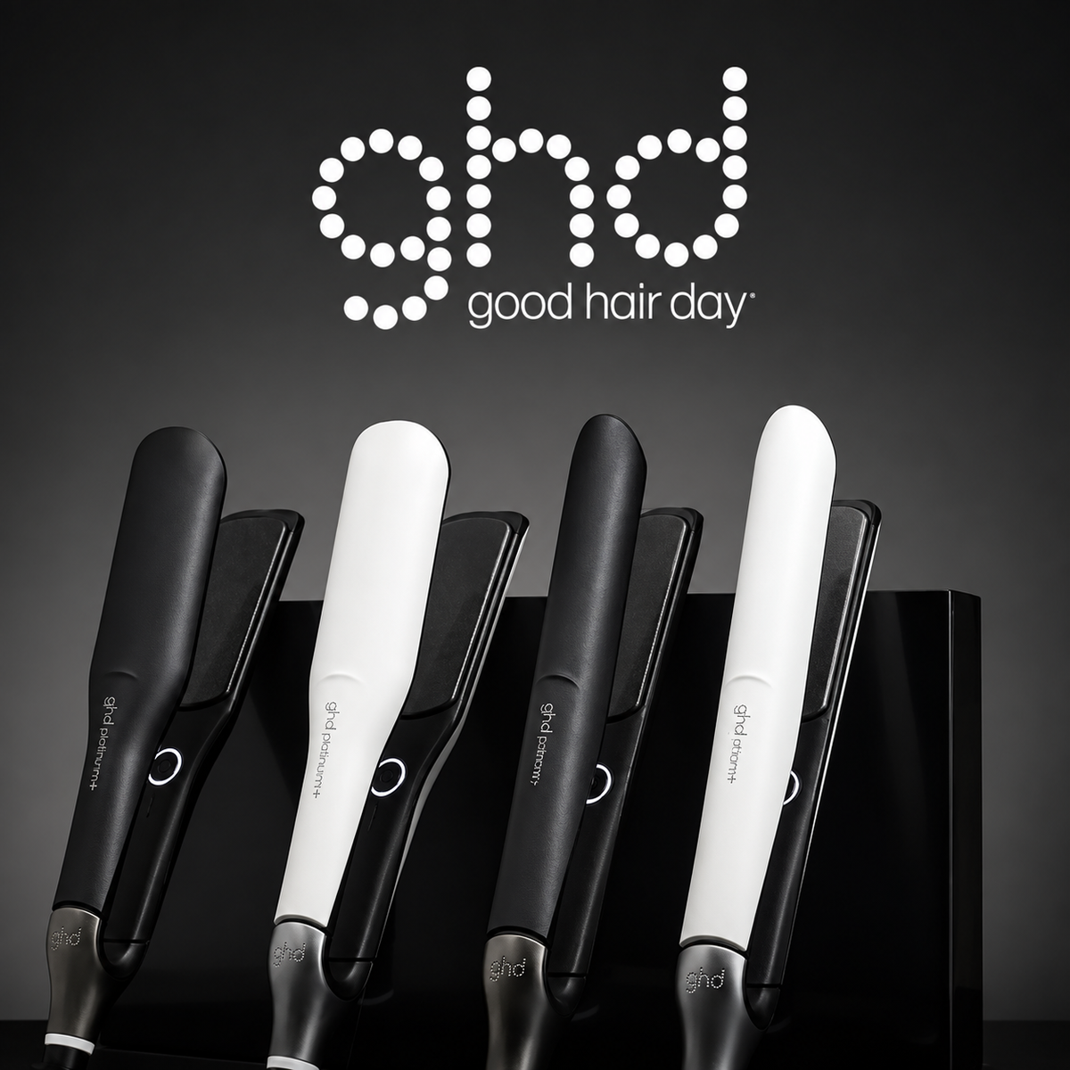 ghd logo above black and white hair straighteners