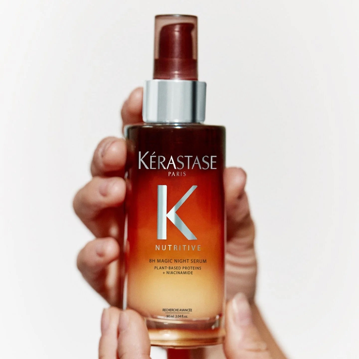 Kérastase Nutritive 8H Magic Night Serum for Dry Hair Curious Salons Canada hand holding bottle 