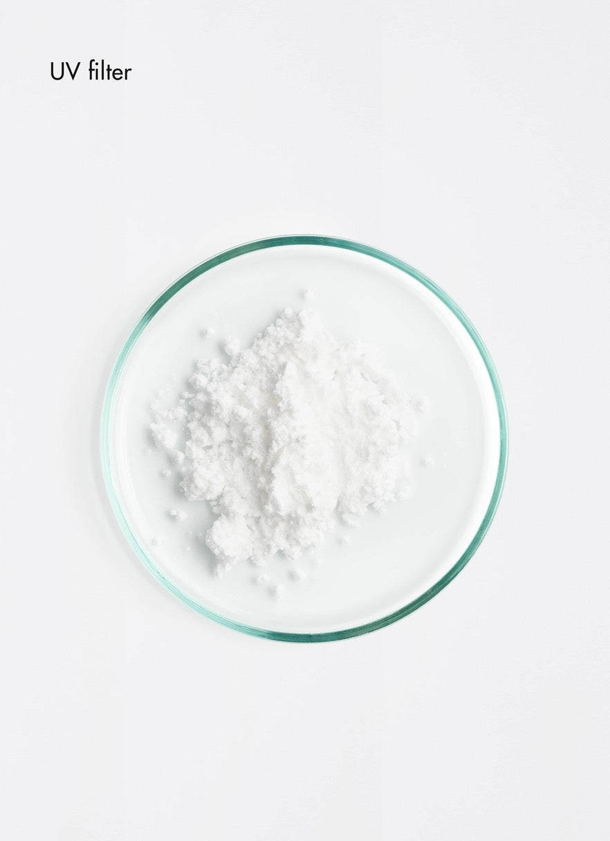 Powder in a glass container on a white background with 'UV filter' text.