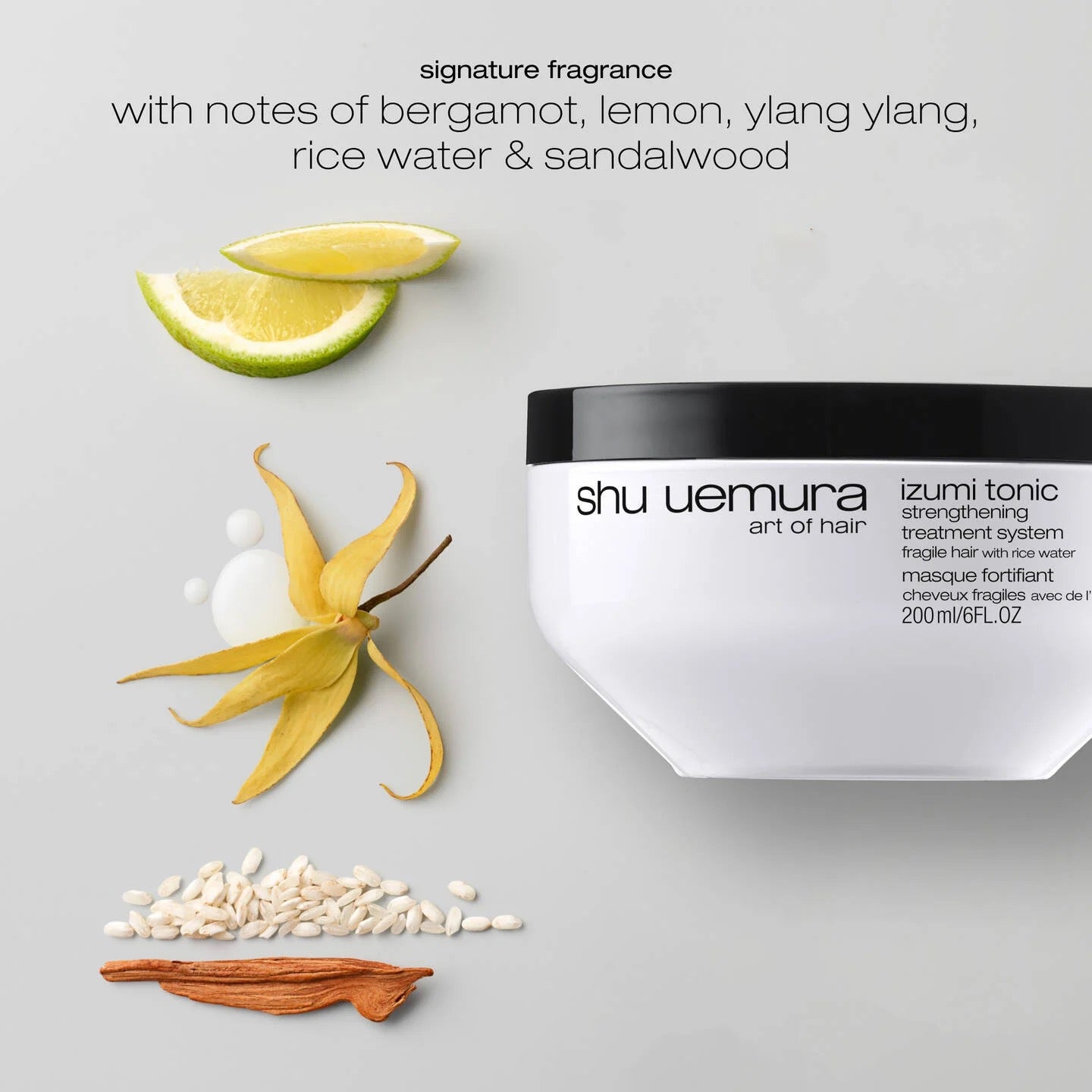 Shu Uemura hair product with ingredients on a light gray background