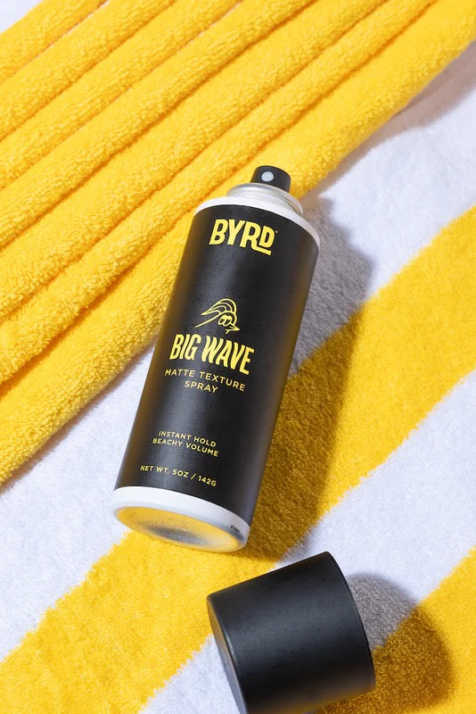 BYRD Big Wave matte texture spray can on a yellow textured surface