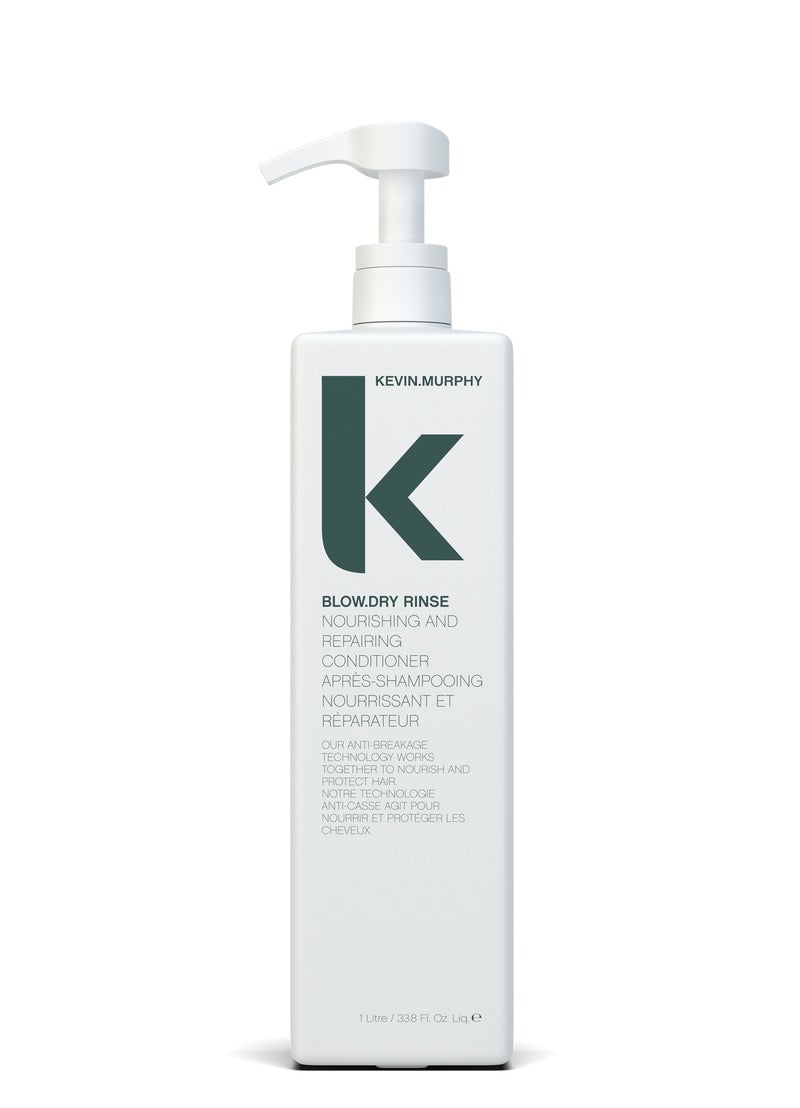 Kevin Murphy Blowdry Rinse nourishing and repairing conditioner in a tall white pump bottle, shown on a clean white background.Curious Salons
