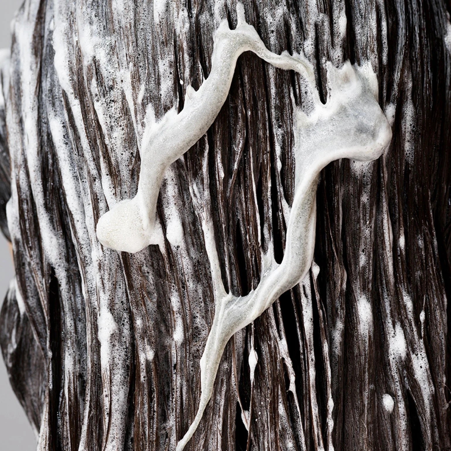 close up of Oribe The Cleanse Clarifying Shampooor buildup removal in Canada