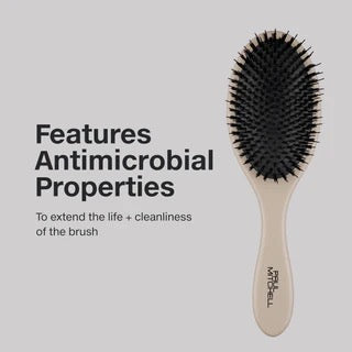 Hairbrush with antimicrobial properties on a light gray background
