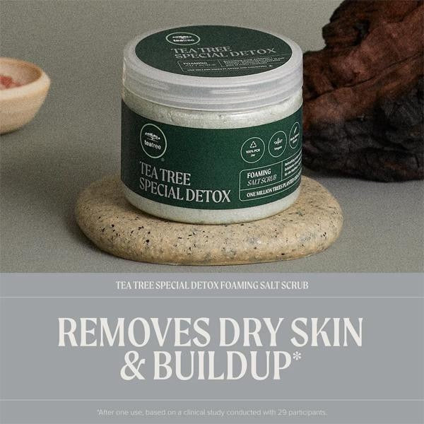 Tea Tree Special Detox foaming salt scrub jar on a stone surface with promotional text. Paul Mitchell Tea Tree Special Detox Foaming Salt Scrub for scalp buildup flakes and excess oil in Canada