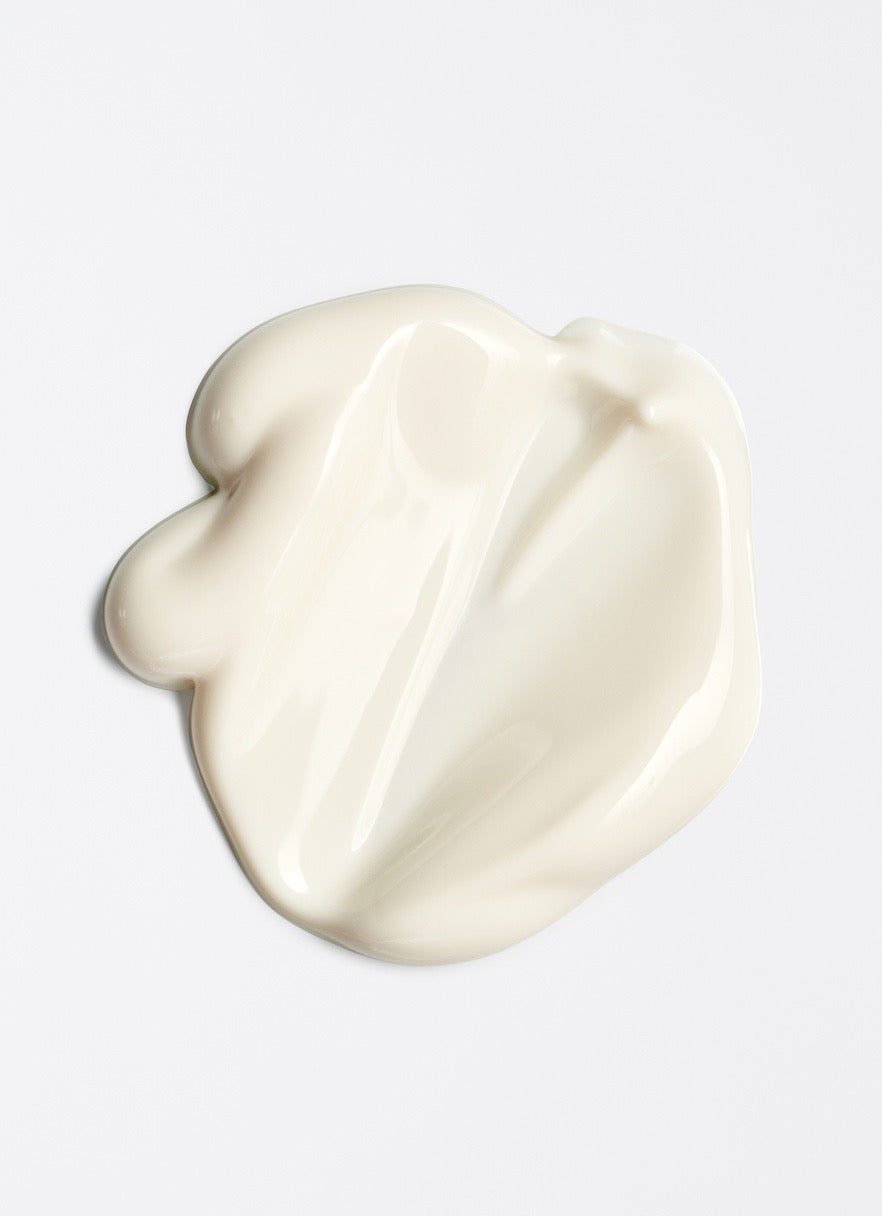 White ceramic object on a light gray background