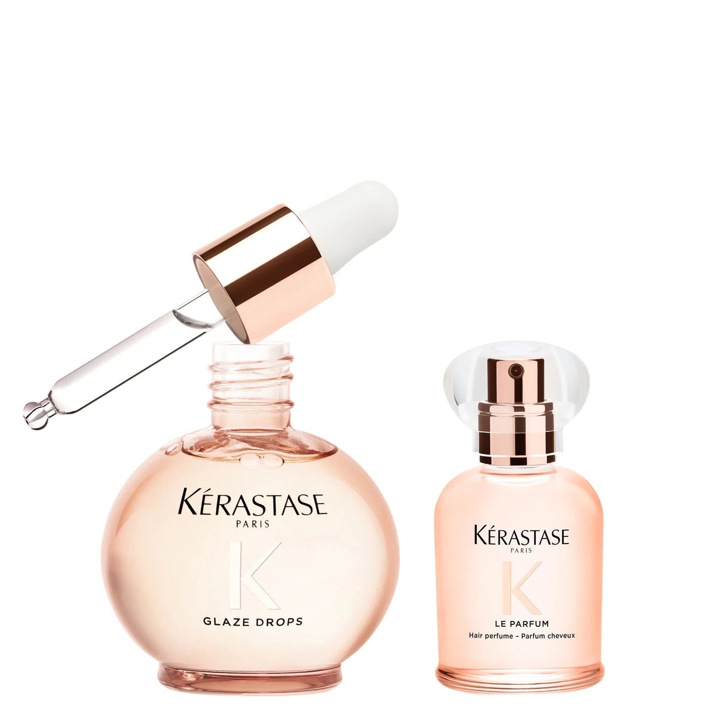 Two Kérastase perfume bottles with a dropper on a white background