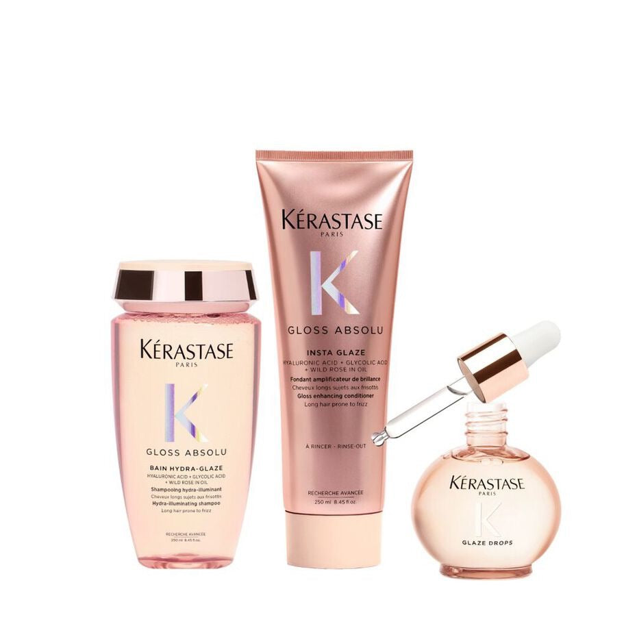 Kérastase hair care products including shampoo, conditioner, and serum on a white background