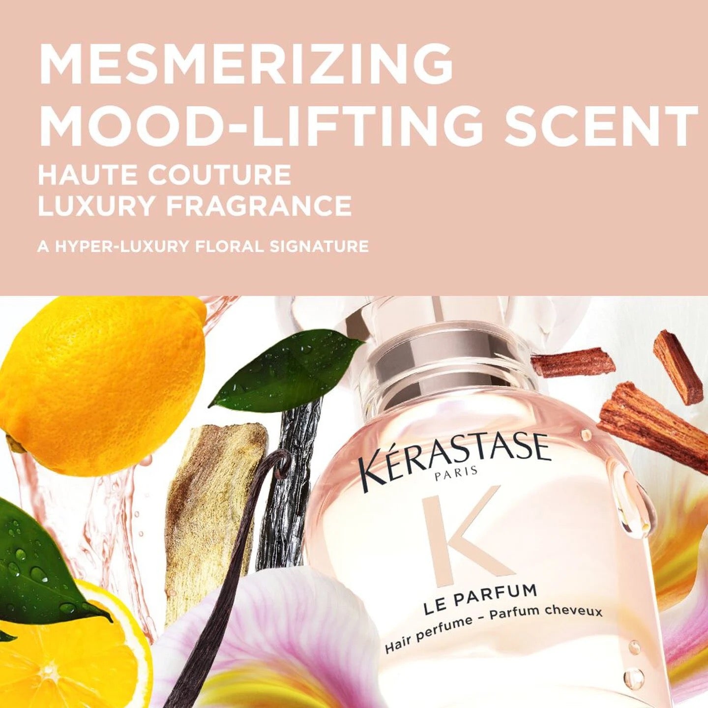 Kérastase perfume bottle with floral and citrus elements on a pink background