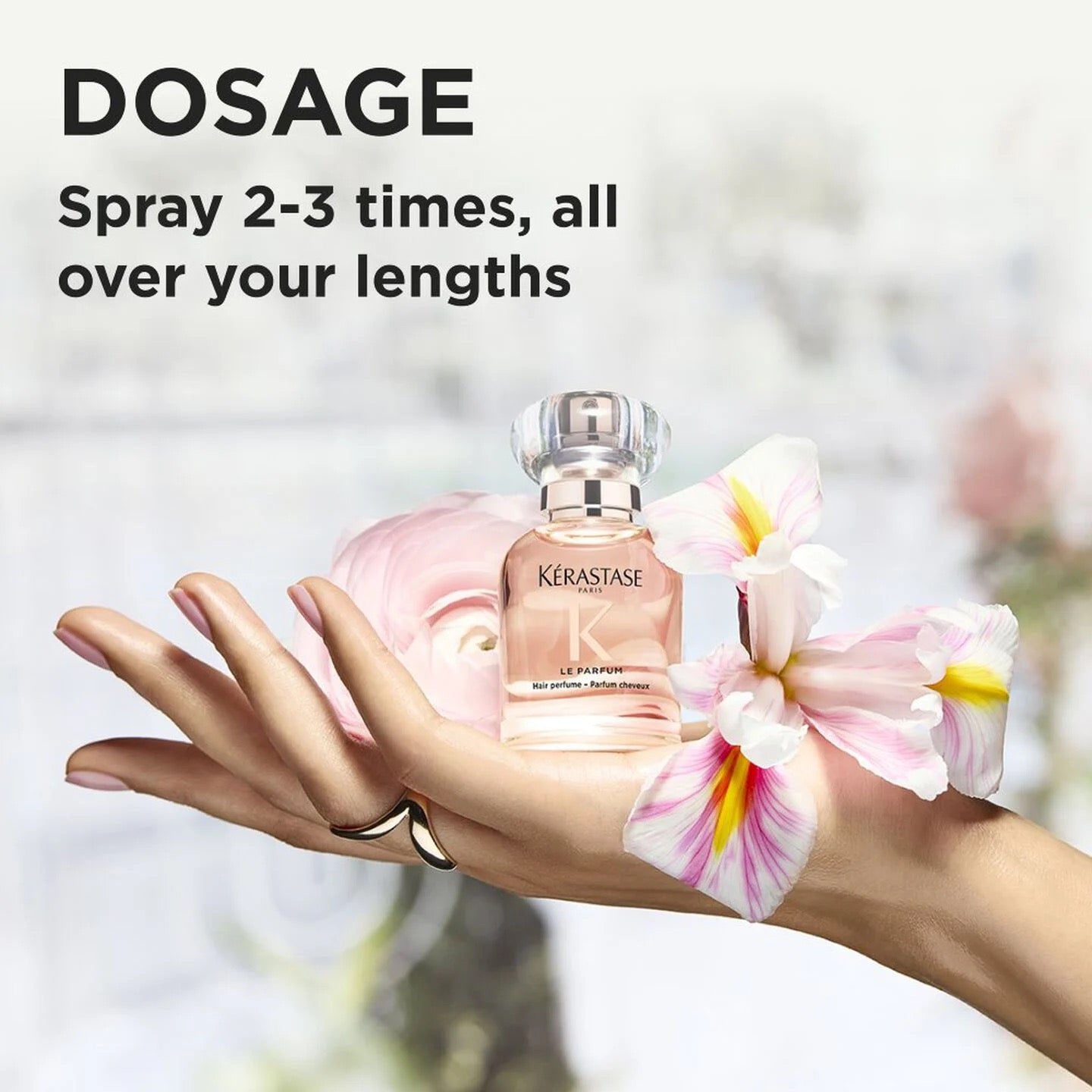 Kérastase hair care product with flowers on a blurred background