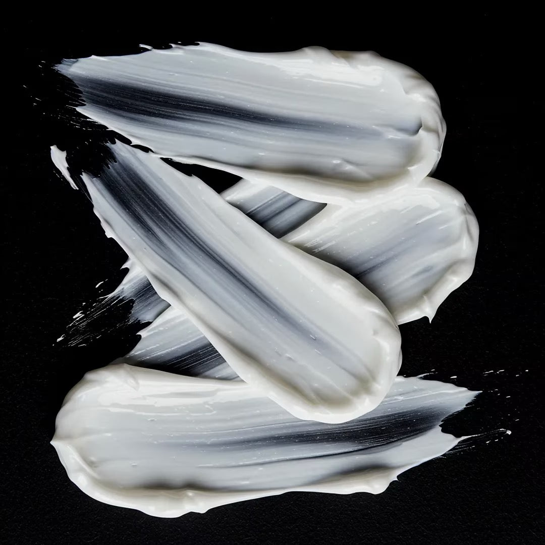 White paint strokes on a black background