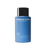 Blue shampoo bottle with black cap on a gray background