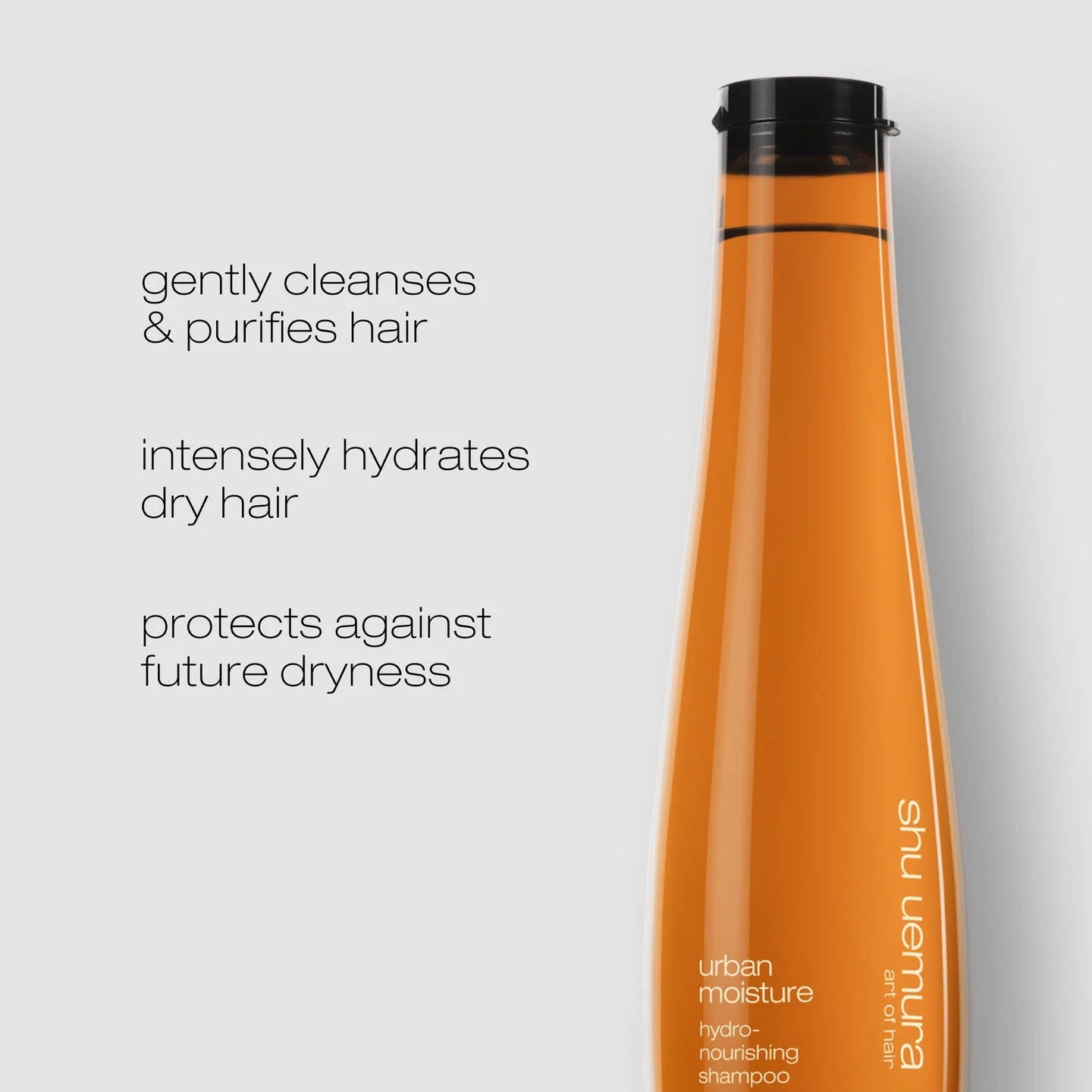 Shu Uemura shampoo bottle on a light gray background with product benefits text.