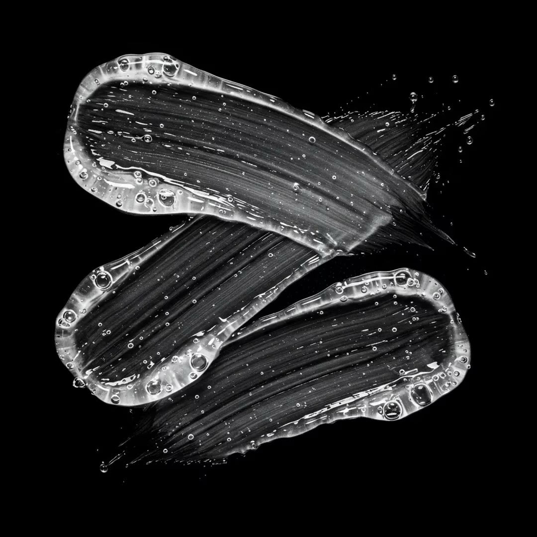 Black and white brush strokes on a black background