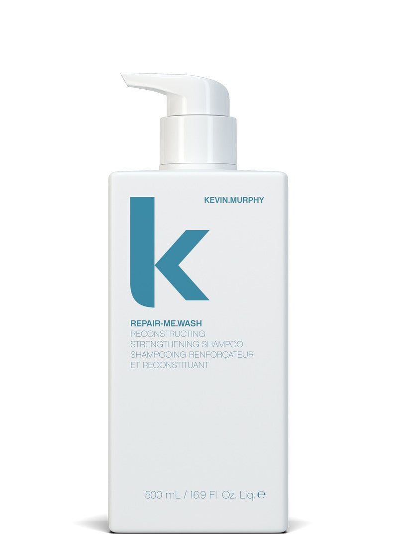 Kevin Murphy Repair-Me Wash Reconstructing Strengthening Shampoo in a 500 mL white rectangular pump bottle with a large teal 'K' logo on a white background.