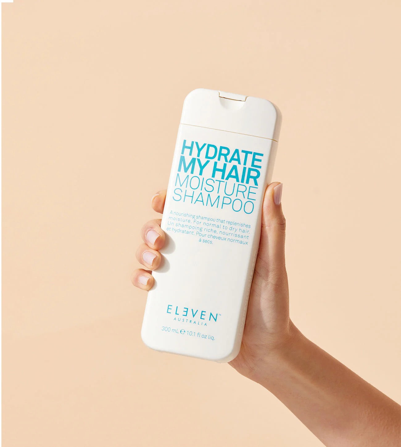 Hydrate My Hair Moisture Shampoo by ELEVEN Australia   in Canada at Curious Salons 300ml being held by hand