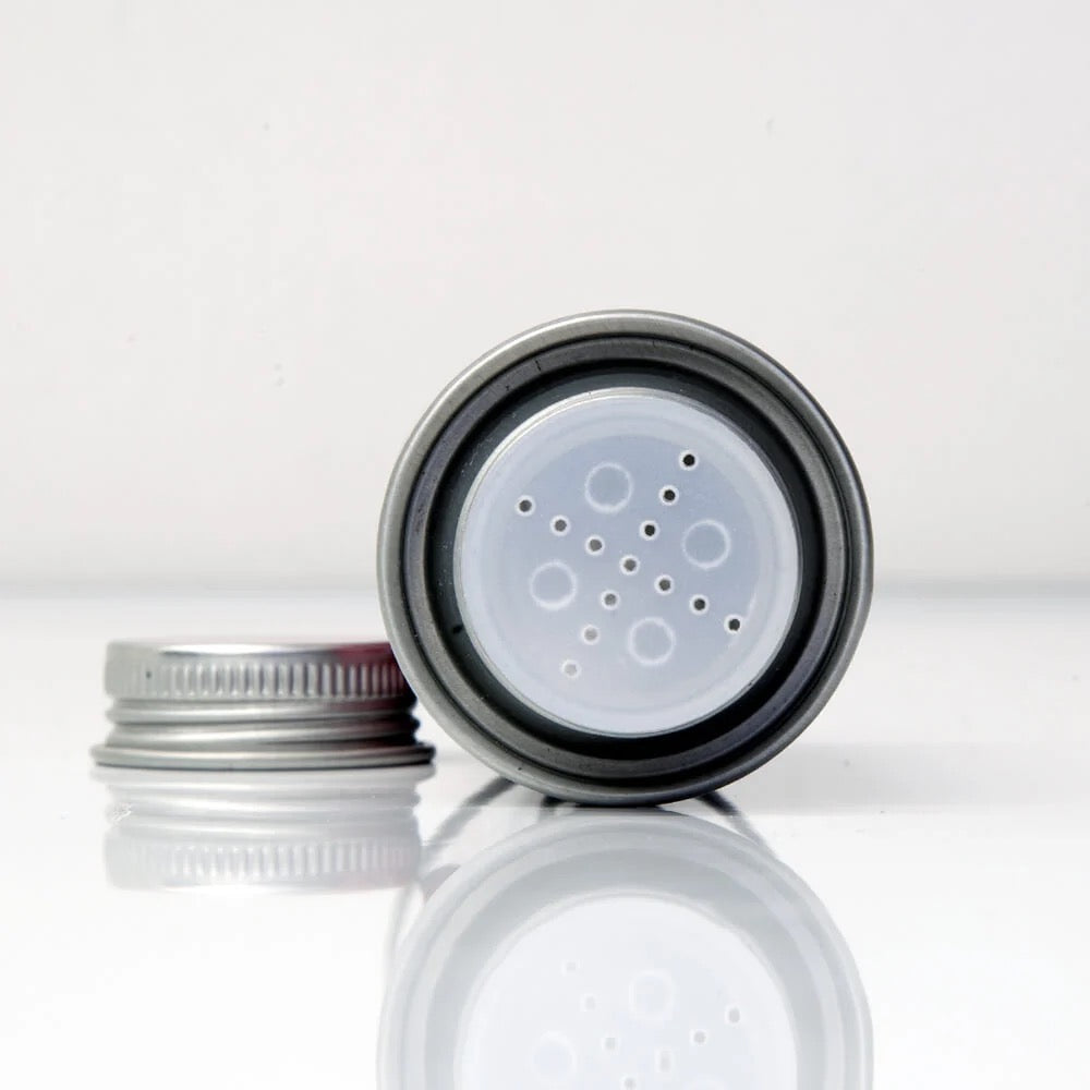 Close-up of a black and clear plastic component on a white background
