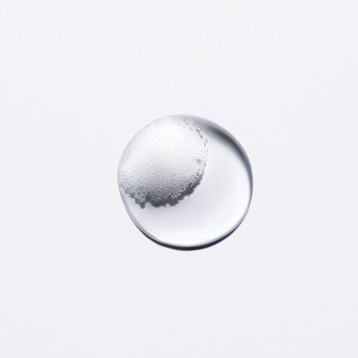 droplet of Kérastase Genesis Bain Nutri-Fortifiant at Curious Salons Canned