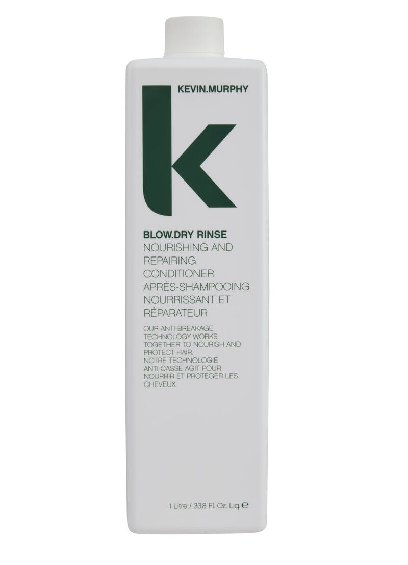 A white bottle of Kevin Murphy Blow.Dry Rinse with a large green 'K' logo on the front, set against a plain white background. one litre Curious Salons