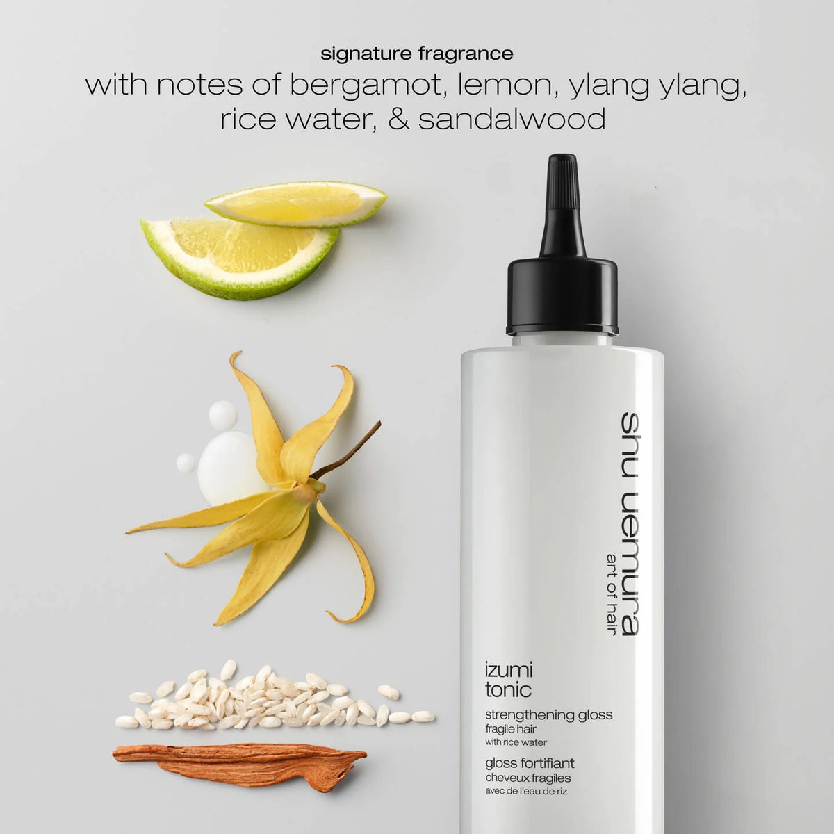 Izumi Nus bottle with natural elements on a gray background Curious Salons Calgary Canada