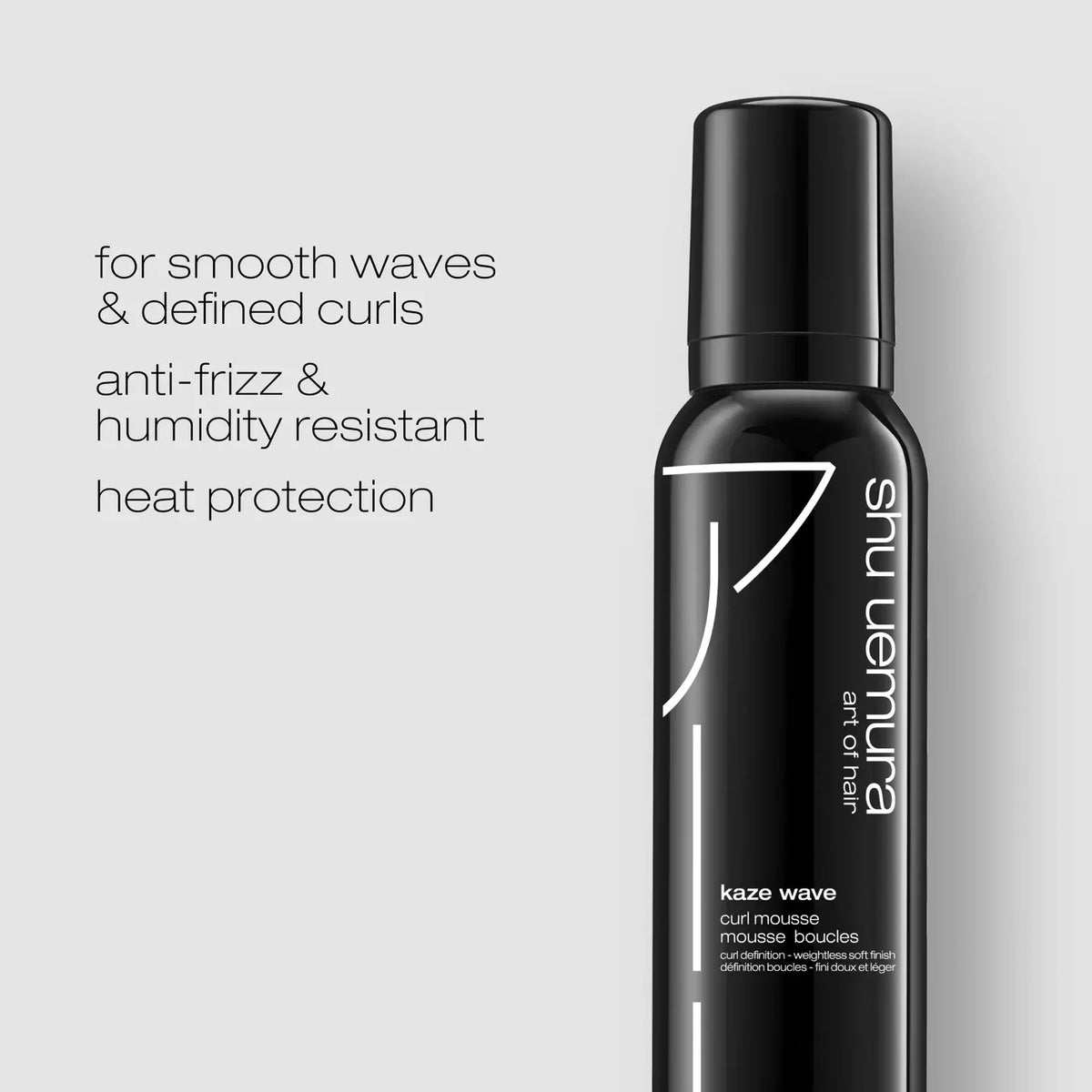 Shu Uemura Kaze Wave Curl Mousse in a matte black aerosol can with white text and logo, shown next to descriptive text on a light gray background.