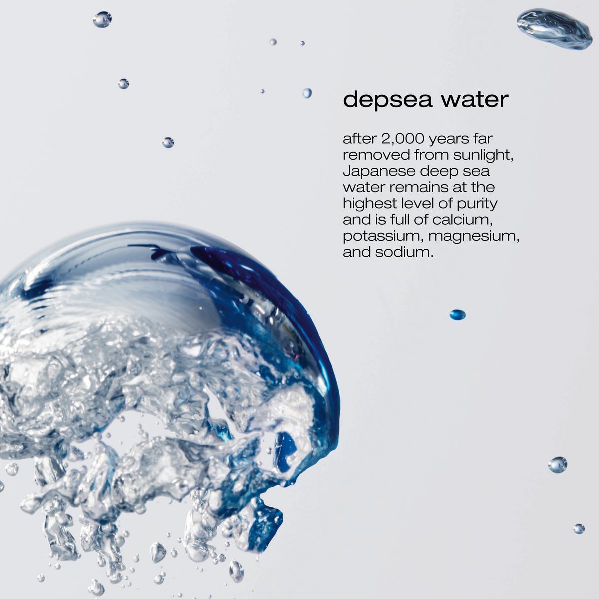Depsea water droplet with text about deep sea water purity and minerals on a light gray background