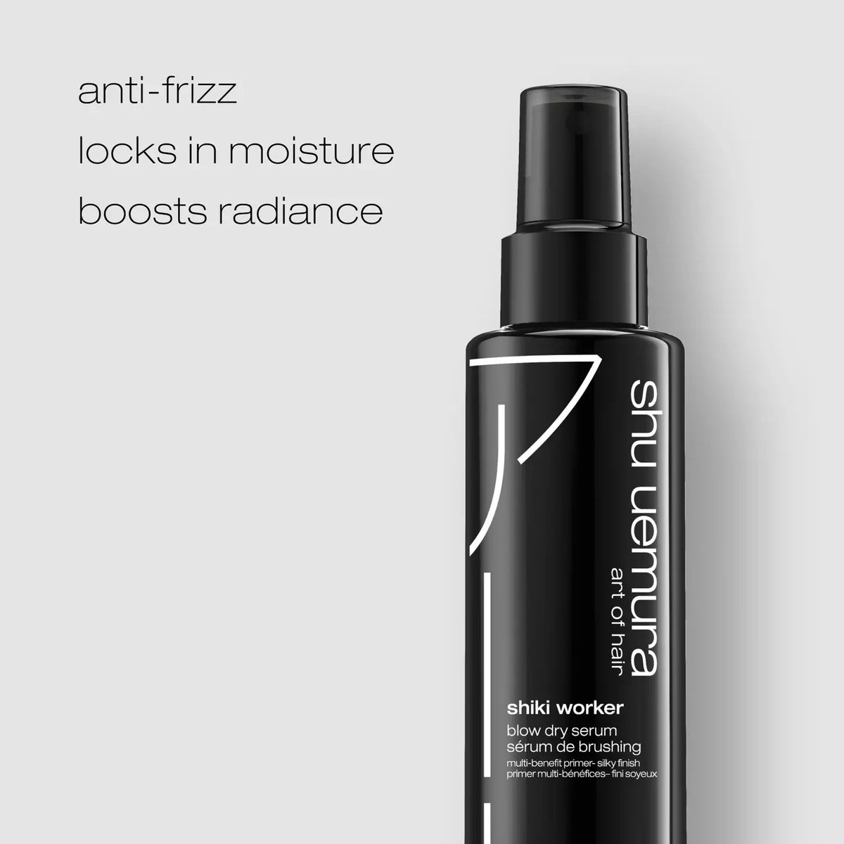 Shu Uemura Shiki Worker Blow Dry Serum bottle in matte black with white text, shown on a light gray background with marketing text on the left.