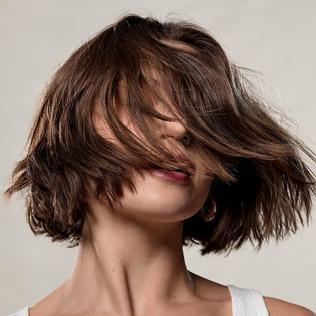 Women with Brow bob Bumble and bumble Surf Foam Wash Shampoo for fine hair volume and beachy texture in Canada