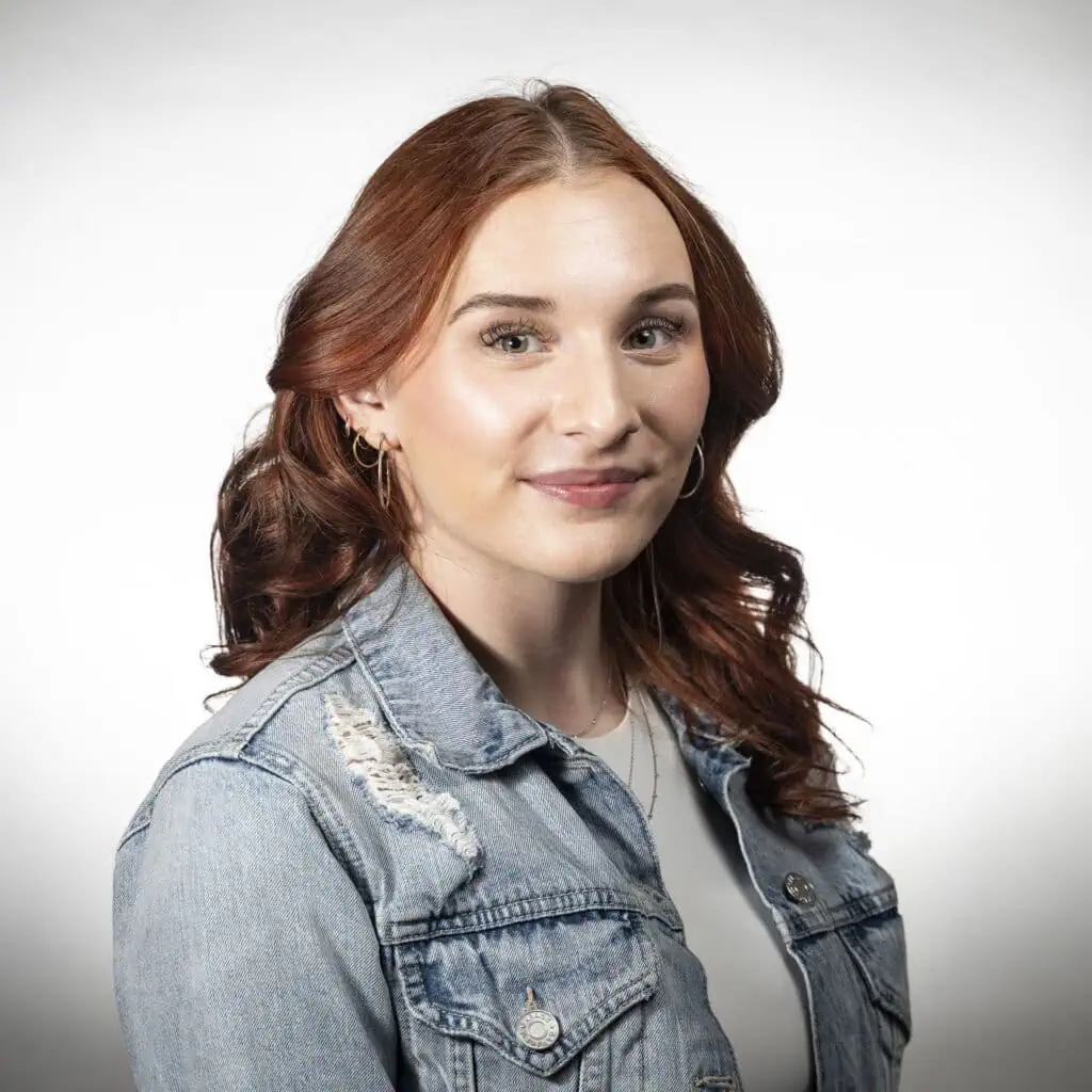 Ella Langham, an apprentice specializing in color services, with a passion for learning.