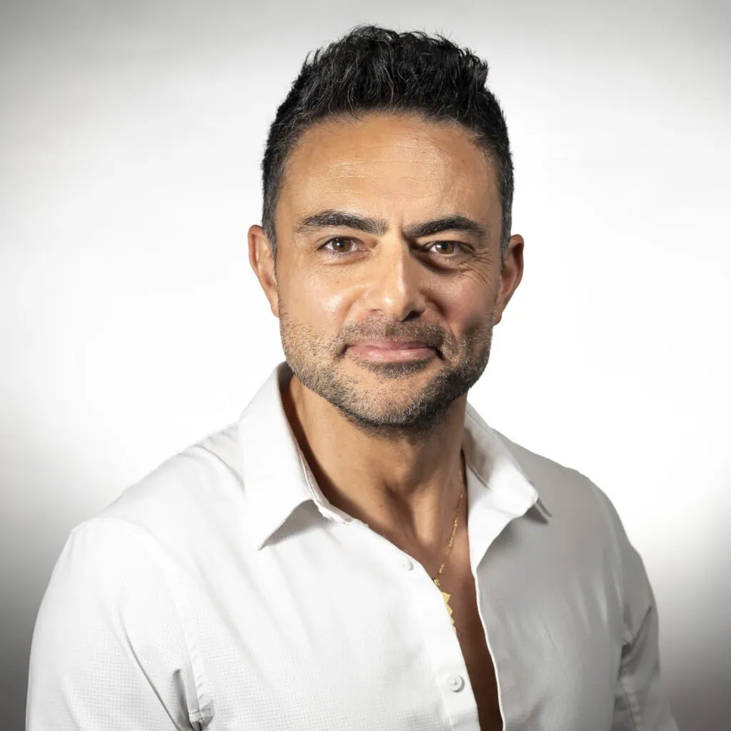 Hassan Abu-hadir, owner and stylist with 26 years of experience, specializing in curly and Afro hair.