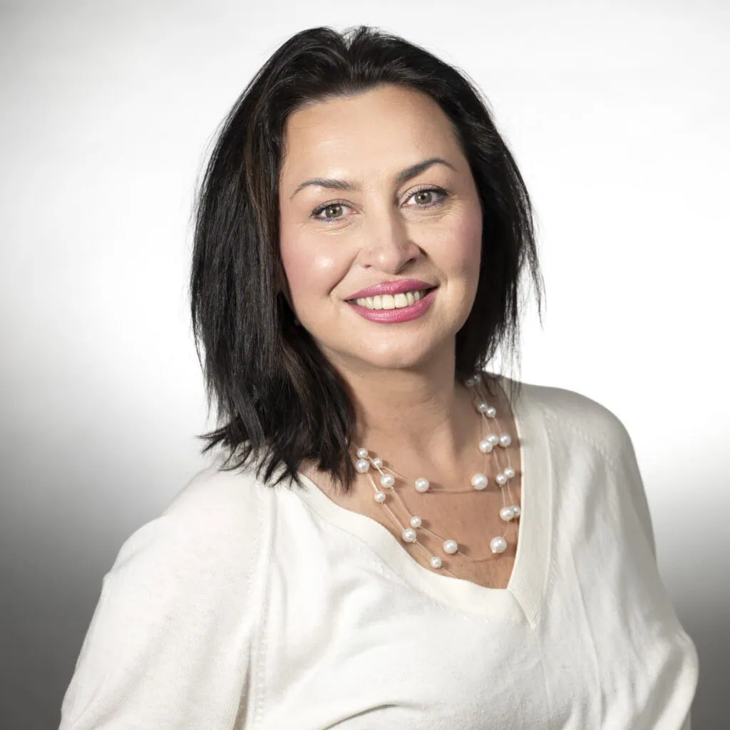 Iryna Kostiuchenko, seasoned stylist with 30 years of experience, specializes in cuts and formal designs.