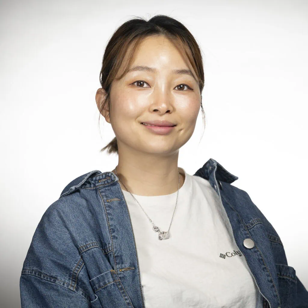 May Lin, stylist specializing in precision haircuts and updos.